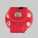 Red pouch with grommets on a black background