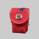Red tool pouch on a black surface with a pen and paper in the background